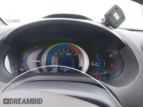 2010 Honda Insight EX with VIN JHMZE2H71AS035091, listed as a IAAI auction lot 41380128 with 181,653 mi miles and . Bid and sale history available at DreamBid. Image 7.