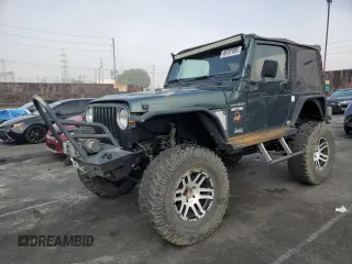 2002 Jeep Wrangler Sahara with VIN 1J4FA59S42P742978, listed as a Copart auction lot 46707685 with 77,272 mi miles and Salvage Title. Bid and sale history available at carsss.com. Image 1.