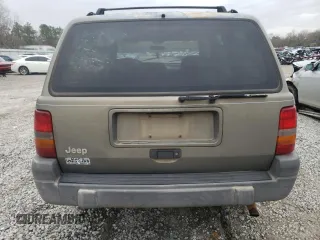 1996 Jeep Grand Cherokee Laredo with VIN 1J4FX58S5TC248122, listed as a Copart auction lot 45843935 with 295,521 mi miles and Salvage Title. Bid and sale history available at carsss.com. Image 6.