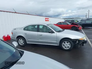 2003 Oldsmobile Alero GL1 z VIN 1G3NL52F93C310114, wystawiony jako IAAI lot #41778264 z przebiegiem Nie podano mil oraz . Historia ofert i sprzedaży dostępna na DreamBid. Obrazek 13.