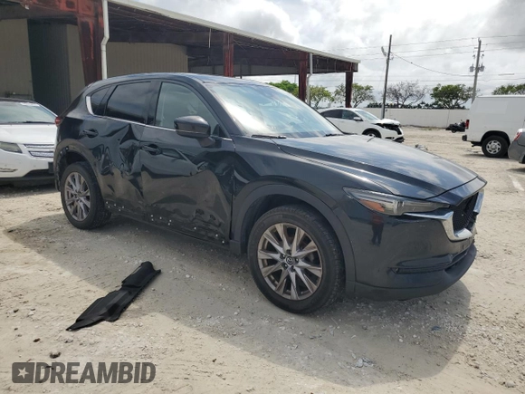 2020 Mazda CX-5 Grand Touring with VIN JM3KFBDM4L0738976, listed as a Copart auction lot 56683955 with 191,650 mi miles and Clean Title. Bid and sale history available at DreamBid. Image 4.