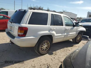 2002 Jeep Grand Cherokee Limited with VIN 1J4GX58S32C320843, listed as a Copart auction lot 77663864 with 289,537 mi miles and Salvage Title. Bid and sale history available at DreamBid. Image 3.