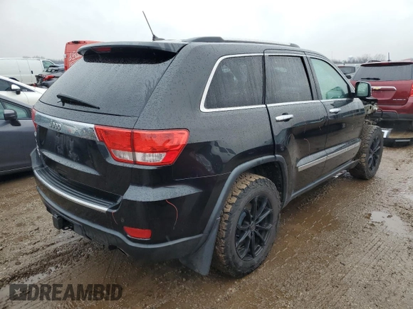 2013 Jeep Grand Cherokee Overland with VIN 1C4RJFCT9DC615096, listed as a Copart auction lot 86817074 with 112,421 mi miles and Salvage Title. Bid and sale history available at carsss.com. Image 3.