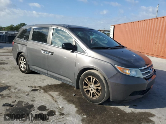 2012 Honda Odyssey EX-L with VIN 5FNRL5H66CB146350, listed as a Copart auction lot 55428555 with 171,207 mi miles and Salvage Title. Bid and sale history available at DreamBid. Image 4.