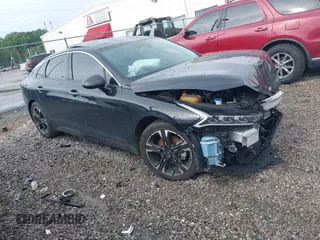 2023 Kia K5 GT-Line z VIN 5XXG64J20PG213348, wystawiony jako IAAI lot #42333459 z przebiegiem 34 392 mil mil oraz . Historia ofert i sprzedaży dostępna na DreamBid. Obrazek 1.