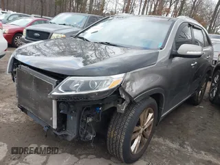 2015 Kia Sorento SX with VIN 5XYKW4A74FG603479, listed as a IAAI auction lot 41515797 with 151,496 mi miles. Bid and sale history available at carsss.com. Image 2.