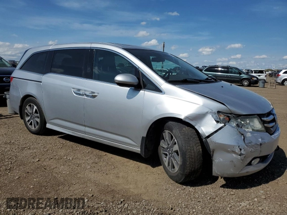 2014 Honda Odyssey Touring with VIN 5FNRL5H91EB502555, listed as a Copart auction lot 61872285 with 203,448 mi miles and Salvage title. Bid and sale history available at DreamBid. Image 4.