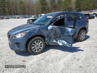 2016 Mazda CX-5 Sport with VIN JM3KE2BY4G0720542, listed as a Copart auction lot 50403865 with 70,214 mi miles and Salvage title. Bid and sale history available at DreamBid. Image 1.