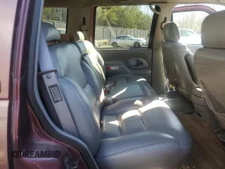 1997 GMC Yukon with VIN 1GKEK13R1VJ702558, listed as a Copart auction lot 85930054 with 165,837 mi miles and Salvage Title. Bid and sale history available at carsss.com. Image 11.