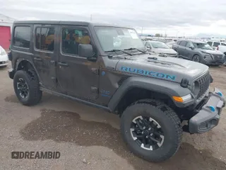 2024 Jeep Wrangler Rubicon with VIN 1C4RJXR67RW276710, listed as a IAAI auction lot 42047318 with 35,857 mi miles and . Bid and sale history available at DreamBid. Image 1.
