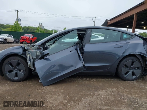 2023 Tesla Model 3 with VIN 5YJ3E1EA9PF673399, listed as a IAAI auction lot 42392643 with 7,571 mi miles and . Bid and sale history available at DreamBid. Image 15.