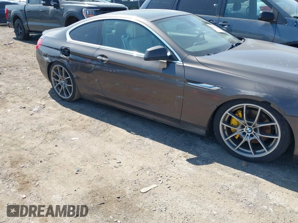 2012 BMW 6 Series 650i z VIN WBALX3C57CC528832, wystawiony jako IAAI lot #41779268 z przebiegiem 75 119 mil mil oraz . Historia ofert i sprzedaży dostępna na DreamBid. Obrazek 6.