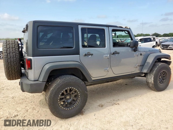 2015 Jeep Wrangler Unlimited Rubicon z VIN 1C4BJWFG0FL529310, wystawiony jako Copart lot #64337405 z przebiegiem Nie podano mil oraz Szkoda całkowita • Salvage title. Historia ofert i sprzedaży dostępna na DreamBid. Obrazek 3.