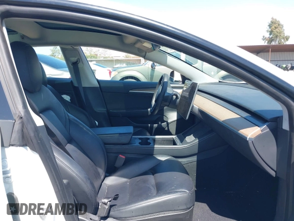 2023 Tesla Model 3 with VIN 5YJ3E1EA2PF571569, listed as a IAAI auction lot 42288715 with 30,271 mi miles and . Bid and sale history available at DreamBid. Image 5.