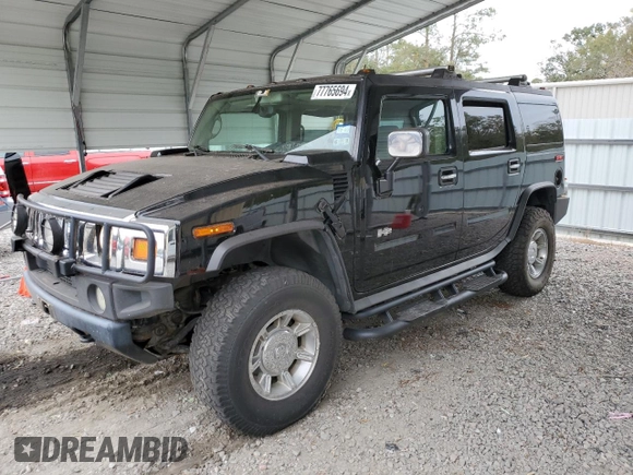 2003 Hummer H2 with VIN 5GRGN23U33H118459, listed as a Copart auction lot 77765694 with 157,390 mi miles and Salvage Title. Bid and sale history available at carsss.com. Image 1.