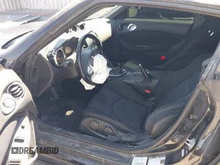 2013 Nissan 370Z z VIN JN1AZ4EH8DM880849, wystawiony jako IAAI lot #42131189 z przebiegiem Nie podano mil oraz . Historia ofert i sprzedaży dostępna na DreamBid. Obrazek 8.