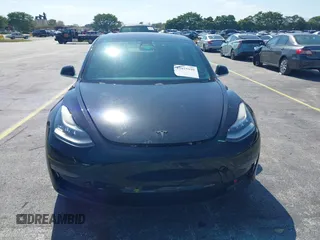 2019 Tesla Model 3 Mid Range with VIN 5YJ3E1EA0KF317058, listed as a IAAI auction lot 42025195 with 108,771 mi miles. Bid and sale history available at carsss.com. Image 6.