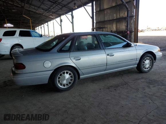 1995 Ford Taurus GL z VIN 1FALP524XSG154141, wystawiony jako Copart lot #77271544 z przebiegiem 72 118 mil mil oraz Czysty tytuł • Clean title. Historia ofert i sprzedaży dostępna na DreamBid. Obrazek 3.