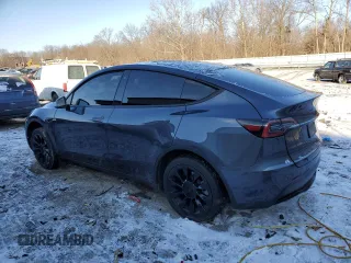 2023 Tesla Model Y Long Range with VIN 7SAYGDEE6PF752570, listed as a Copart auction lot 84927794 with 52,297 mi miles and Salvage Title. Bid and sale history available at DreamBid. Image 2.