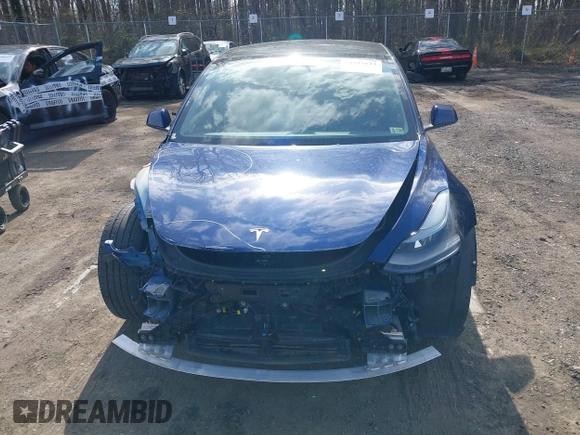 2022 Tesla Model 3 with VIN 5YJ3E1EA7NF188417, listed as a IAAI auction lot 41885623 with 105,457 mi miles and . Bid and sale history available at DreamBid. Image 12.