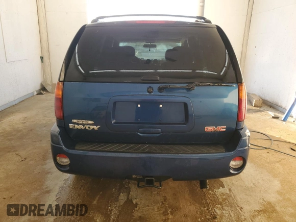 2005 GMC Envoy SLT with VIN 1GKDS13S652339845, listed as a Copart auction lot 77693684 with 220,306 mi miles and Salvage Title. Bid and sale history available at carsss.com. Image 6.