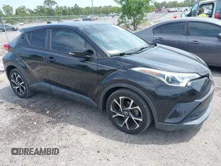 2018 Toyota C-HR XLE with VIN NMTKHMBX0JR008423, listed as a IAAI auction lot 42091445 with 124,811 mi miles. Bid and sale history available at carsss.com. Image 1.