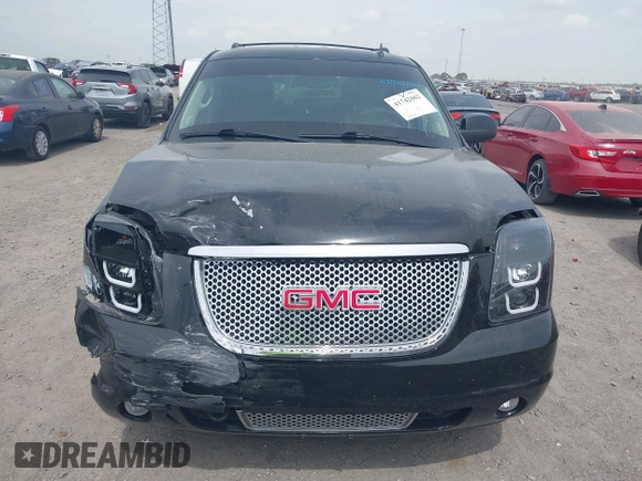 2014 GMC Yukon Denali z VIN 1GKS1EEFXER113493, wystawiony jako IAAI lot #41742662 z przebiegiem 150 382 mil mil oraz . Historia ofert i sprzedaży dostępna na DreamBid. Obrazek 12.