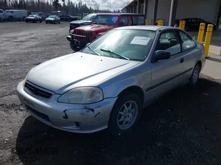 1999 Honda Civic HX with VIN 1HGEJ7122XL020224, listed as a IAAI auction lot 41723460 with 202,759 mi miles. Bid and sale history available at carsss.com. Image 2.