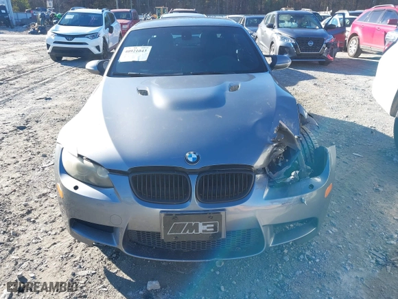 2011 BMW M3 with VIN WBSDX9C57BE584727, listed as a IAAI auction lot 40921043 with 148,068 mi miles. Bid and sale history available at carsss.com. Image 12.