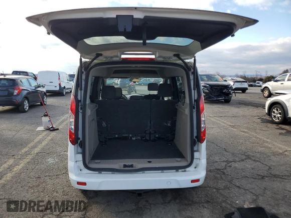 2016 Ford Transit Connect XLT with VIN NM0AE8F7XG1234396, listed as a Copart auction lot 83246404 with 82,787 mi miles and Salvage title. Bid and sale history available at DreamBid. Image 6.