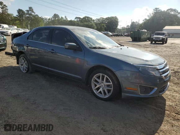2012 Ford Fusion SEL z VIN 3FAHP0JA9CR333944, wystawiony jako Copart lot #56907605 z przebiegiem 180 386 mil mil oraz Szkoda całkowita • Salvage title. Historia ofert i sprzedaży dostępna na DreamBid. Obrazek 4.