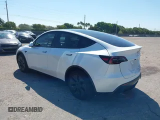 2024 Tesla Model Y with VIN 7SAYGDED9RF161420, listed as a IAAI auction lot 41892788 with 12,353 mi miles and . Bid and sale history available at DreamBid. Image 3.