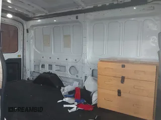 2015 Ford Transit Cargo z VIN 1FTNR2CM1FKA40154, wystawiony jako IAAI lot #42210986 z przebiegiem 164 324 mil mil oraz . Historia ofert i sprzedaży dostępna na DreamBid. Obrazek 8.