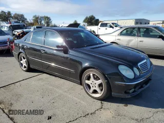 2004 Mercedes-Benz E-Class 5.0L with VIN WDBUF70J64A585084, listed as a Copart auction lot 80297124 with 233,638 mi miles and Salvage Title. Bid and sale history available at carsss.com. Image 4.