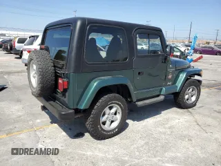 2000 Jeep Wrangler Sahara z VIN 1J4FA59S1YP746043, wystawiony jako Copart lot #58842665 z przebiegiem 148 348 mil mil oraz Szkoda całkowita • Salvage title. Historia ofert i sprzedaży dostępna na DreamBid. Obrazek 3.