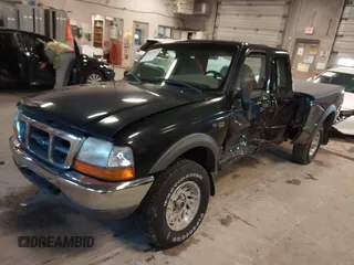 1999 Ford Ranger XL with VIN 1FTZR15V4XPB56809, listed as a IAAI auction lot 41874991 with 165,487 mi miles. Bid and sale history available at carsss.com. Image 2.