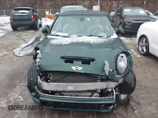 2017 MINI Convertible Cooper S z VIN WMWWG9C38H3C81071, wystawiony jako IAAI lot #41522738 z przebiegiem 59 040 mil mil oraz . Historia ofert i sprzedaży dostępna na DreamBid. Obrazek 12.
