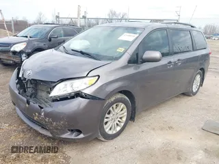 2014 Toyota Sienna XLE with VIN 5TDYK3DC4ES463315, listed as a IAAI auction lot 42108050 with 197,140 mi miles. Bid and sale history available at carsss.com. Image 2.