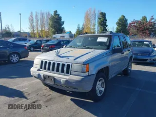1996 Jeep Grand Cherokee Laredo with VIN 1J4FX58S8TC169575, listed as a IAAI auction lot 40971134 with 152,116 mi miles. Bid and sale history available at carsss.com. Image 2.