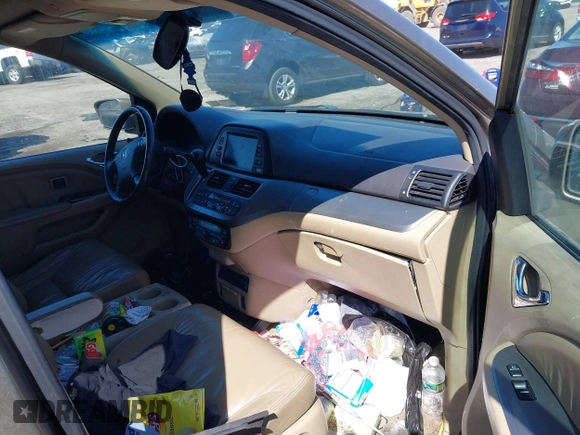 2010 Honda Odyssey Touring with VIN 5FNRL3H9XAB094765, listed as a IAAI auction lot 41892743 with 127,143 mi miles. Bid and sale history available at carsss.com. Image 5.