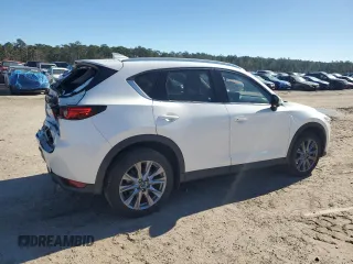 2021 Mazda CX-5 Grand Touring with VIN JM3KFBDM0M1440565, listed as a Copart auction lot 87089404 with 34,607 mi miles and Salvage Title. Bid and sale history available at carsss.com. Image 3.