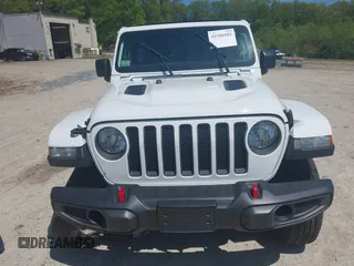 2021 Jeep Wrangler Unlimited Rubicon with VIN 1C4HJXFG5MW586842, listed as a IAAI auction lot 42186683 with 76,450 mi miles and . Bid and sale history available at DreamBid. Image 12.