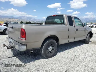 2001 Ford F-150 with VIN 1FTPX17L21NA37619, listed as a Copart auction lot 56922485 with 212,148 mi miles and Salvage title. Bid and sale history available at DreamBid. Image 3.