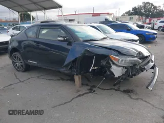 2015 Scion tC with VIN JTKJF5C76F3094314, listed as a IAAI auction lot 41557740 with 100,863 mi miles. Bid and sale history available at carsss.com. Image 1.