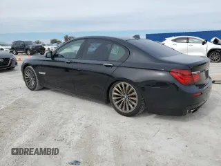 2015 BMW 7 Series 740i with VIN WBAYA6C50FD826727, listed as a Copart auction lot 82197433 with 241,799 mi miles and . Bid and sale history available at DreamBid. Image 2.