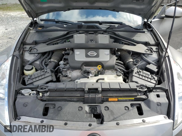 2009 Nissan 370Z z VIN JN1AZ44E69M405389, wystawiony jako Copart lot #43340975 z przebiegiem 31 521 mil mil oraz Szkoda całkowita • Salvage title. Historia ofert i sprzedaży dostępna na DreamBid. Obrazek 12.