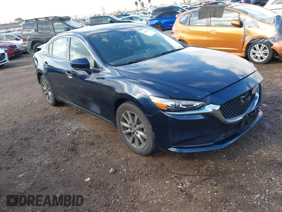 2020 Mazda 6 Sport with VIN JM1GL1UM5L1519519, listed as a IAAI auction lot 41920571 with 59,378 mi miles and . Bid and sale history available at DreamBid. Image 1.
