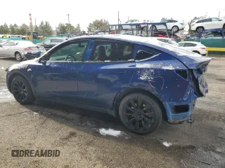 2020 Tesla Model Y Long Range z VIN 5YJYGDEE8LF029553, wystawiony jako Copart lot #51010665 z przebiegiem 42 877 mil mil oraz Szkoda całkowita • Salvage title. Historia ofert i sprzedaży dostępna na DreamBid. Obrazek 2.