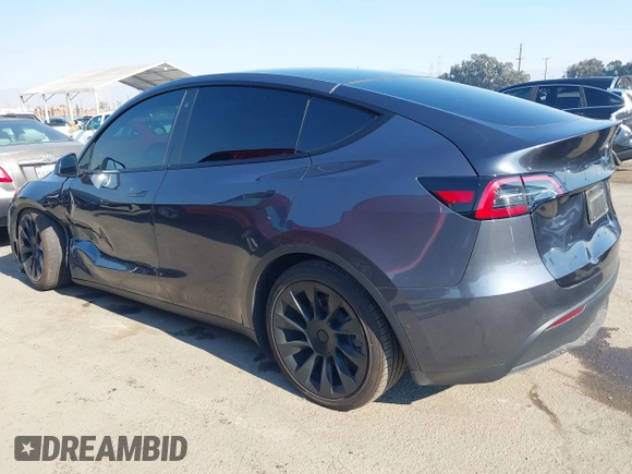 2022 Tesla Model Y Long Range z VIN 7SAYGDEE4NF522698, wystawiony jako IAAI lot #41287885 z przebiegiem 82 306 mil mil oraz . Historia ofert i sprzedaży dostępna na DreamBid. Obrazek 3.