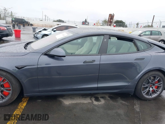 2022 Tesla Model S with VIN 5YJSA1E52NF459460, listed as a IAAI auction lot 41736236 with Not Provided miles and . Bid and sale history available at DreamBid. Image 14.